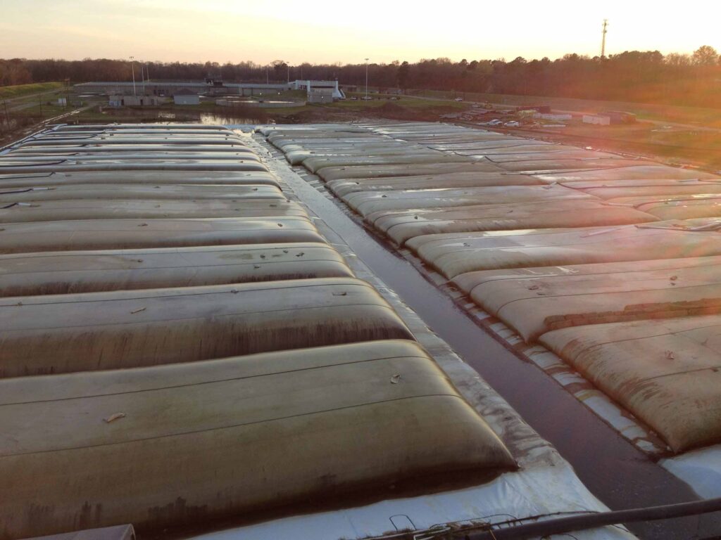 Geotextile tube sludge lagoon closure — west cell dewatering at sunset