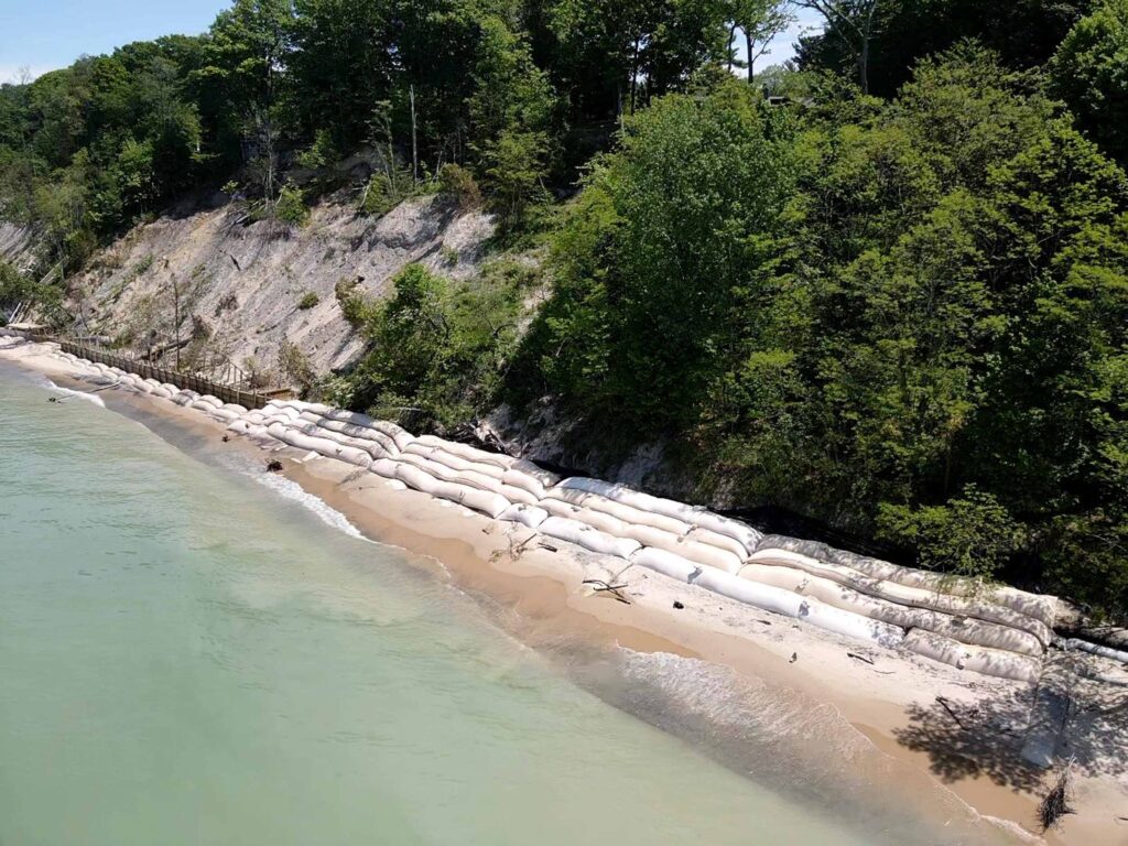 TITANBag® Great Lakes bluff protection — aerial view of bag revetment along sandy shoreline