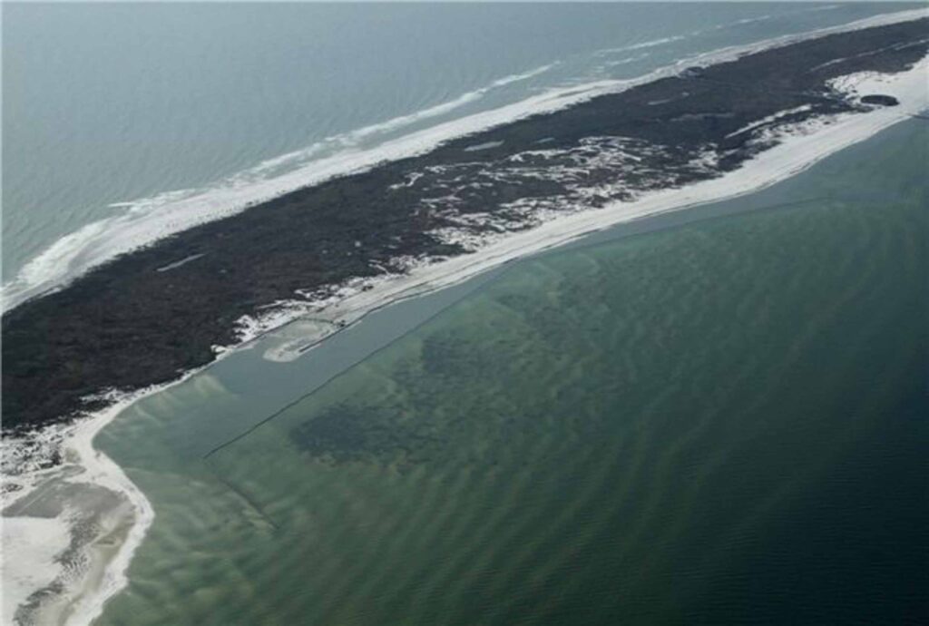 TITANBag® coastal shoreline stabilization — aerial view of geotextile structure protecting barrier island