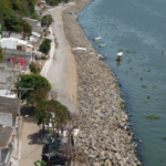 La Trocha completed revetment — aerial view of armor stone shoreline with road access restored