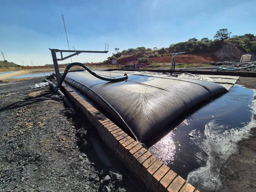 TITANTube® coal wash dewatering — close-up effluent discharge on containment pad
